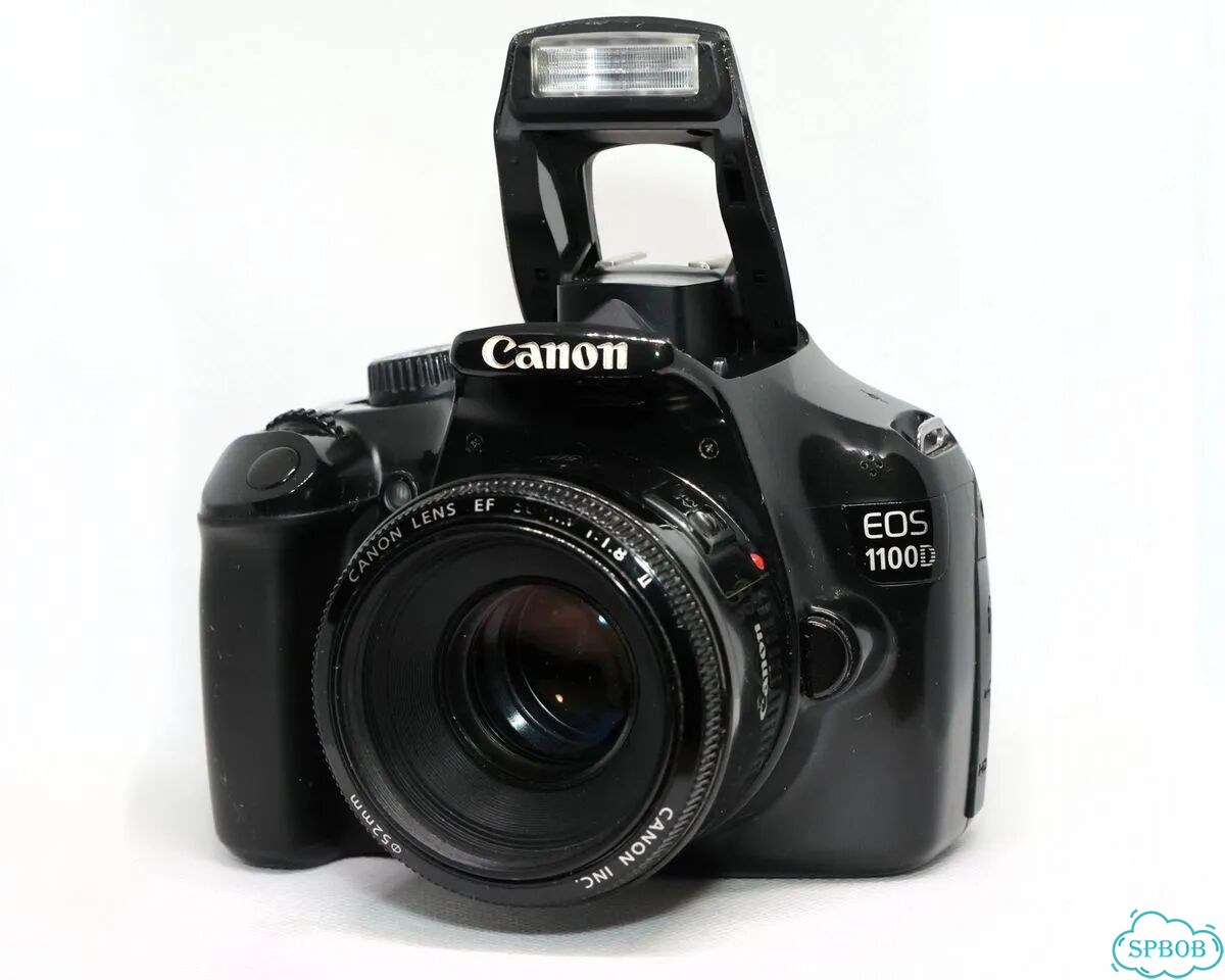 Фотоаппарат Canon EOS 1100D с объективом фото 1